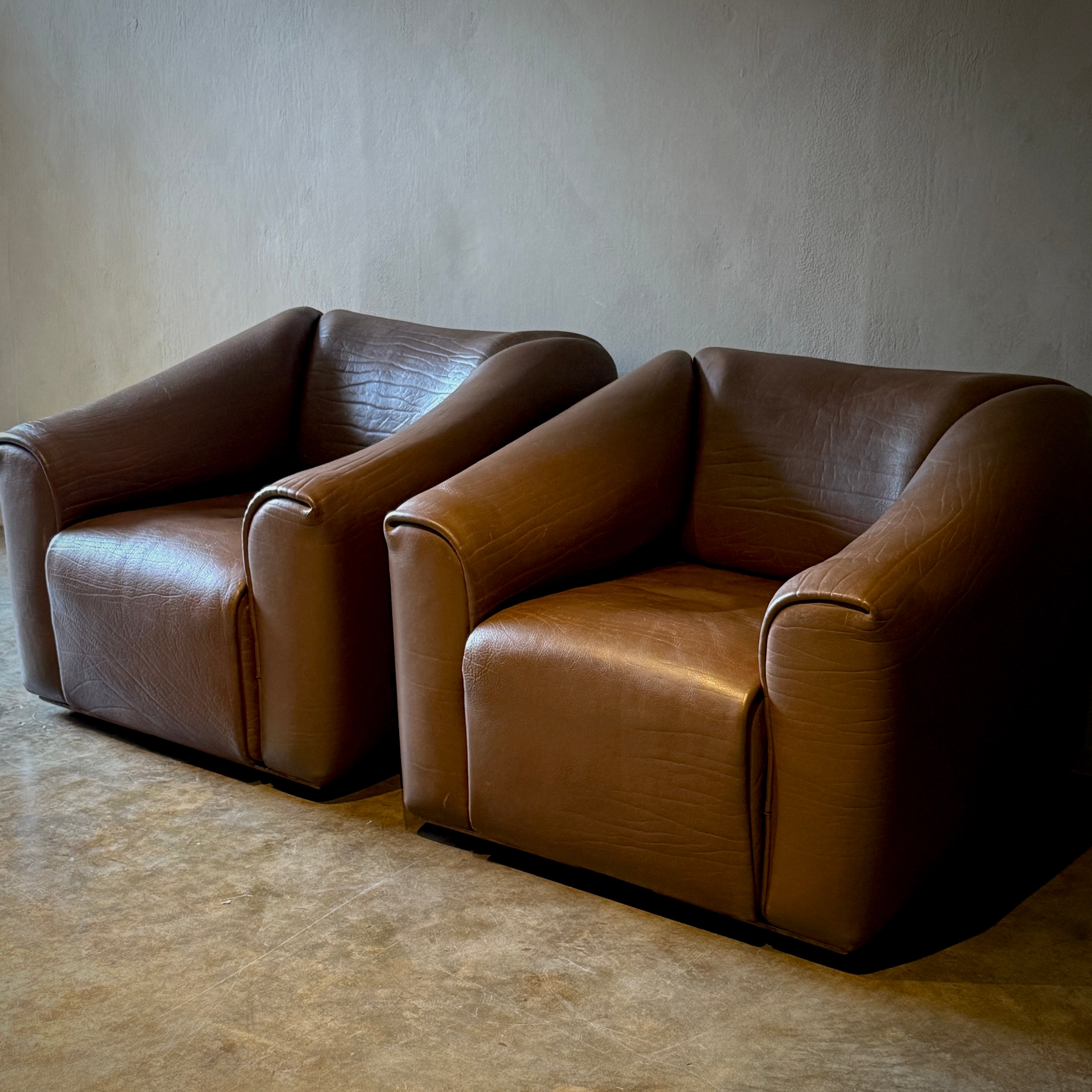 Pair of De Sede Lounge Chairs With Ottoman